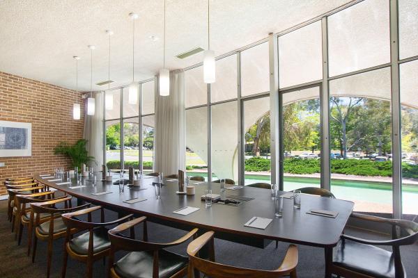 The Becker Room is a grand boardroom bathed in natural light and equipped with modern AV facilities.