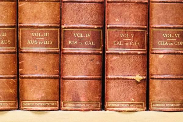 Old classic books sitting on a shelf