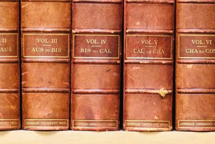 Old classic books sitting on a shelf